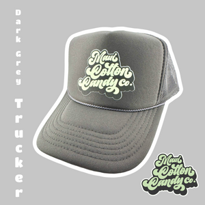 Image of a Dark Grey foam trucker hat with the Maui Cotton Candy Co. logo on the front of the hat